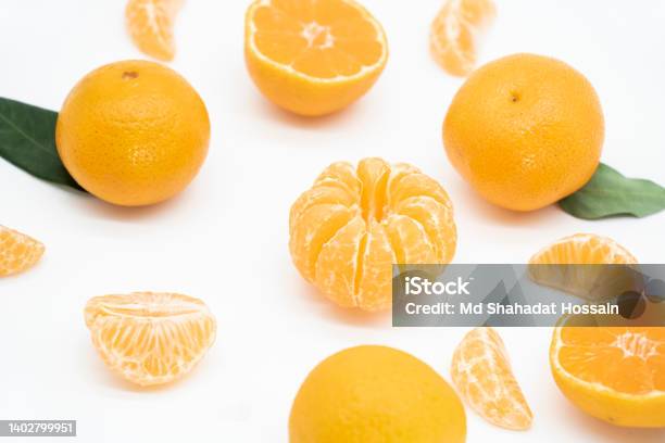 Whole And Slice Tangerine Or Kamala In A Plate Isolated On White Background View From Top Stock Photo - Download Image Now