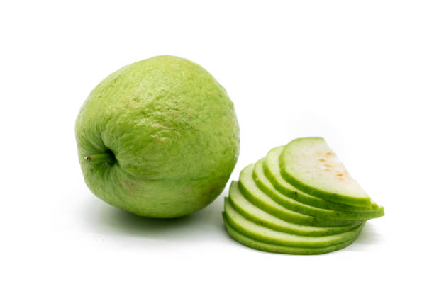 Whole and slices Guava isolated on the white background, stock photo