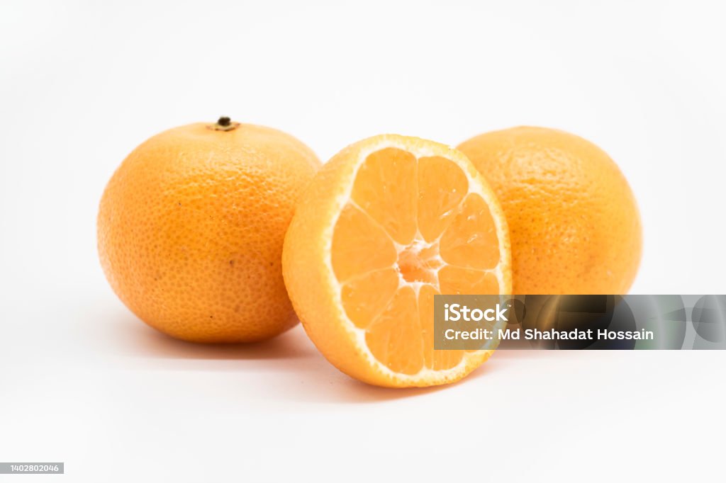 whole and slice Tangerine or kamala over on white background, Bangladesh Stock Photo