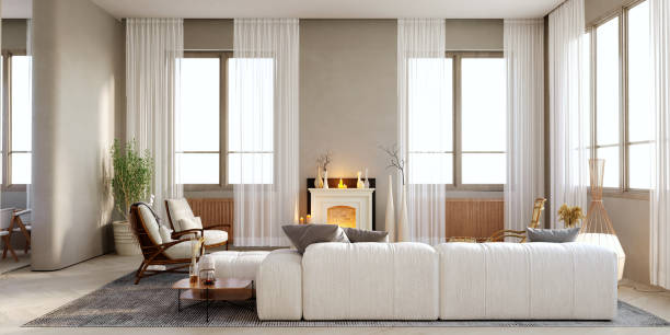 istock 3d rendering,3d illustration, Interior Scene and  Mockup,Modern living area, white sofa, dark wood armchair, center table, wooden legs, glass top in the middle of the room, luxury style fireplace. 1402804530