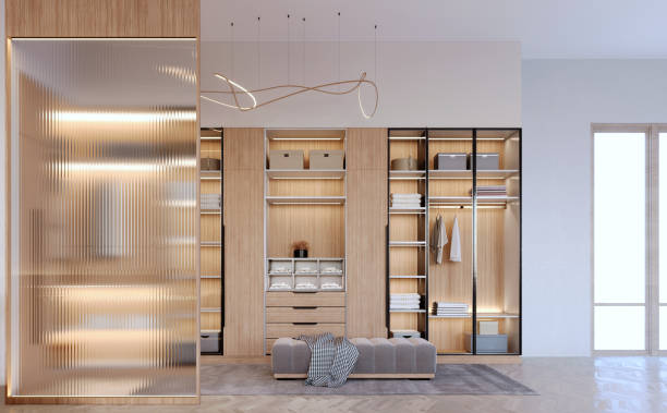 istock 3d rendering,3d illustration, Interior Scene and  Mockup,Modern style walk-in closet, light-colored wood material, decorated with warm-white lights. 1402804696