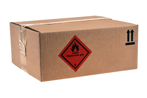 Cardboard box with a label on which is written flammable gas