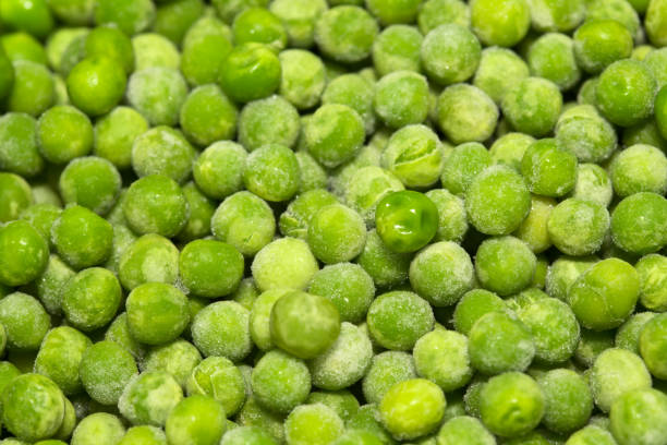 istock Partially defrosted frozen peas 1402807183