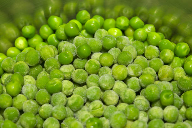 istock Partially defrosted frozen peas 1402807884