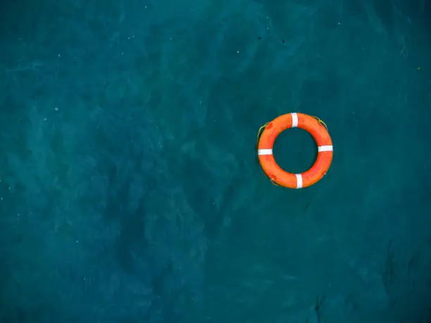 Aerial view of lifebuoy in the sea. Life ring floating in a sea.