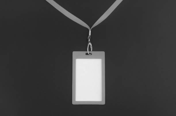 istock Black badge with ribbon on black background 1402808403