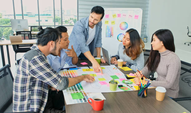 istock Group of creative design meeting brainstorm ideas to plan and develop project at office, Small business startup coworker, colleagues working  for the solution, Coorperate team 1402811456
