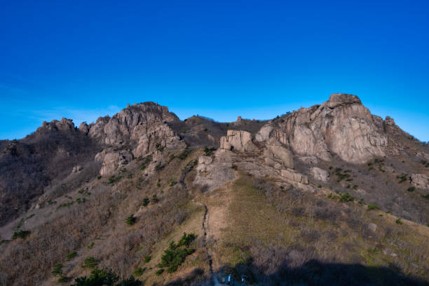 istock Scenic view of mountains against sky during sunrise 1402812407