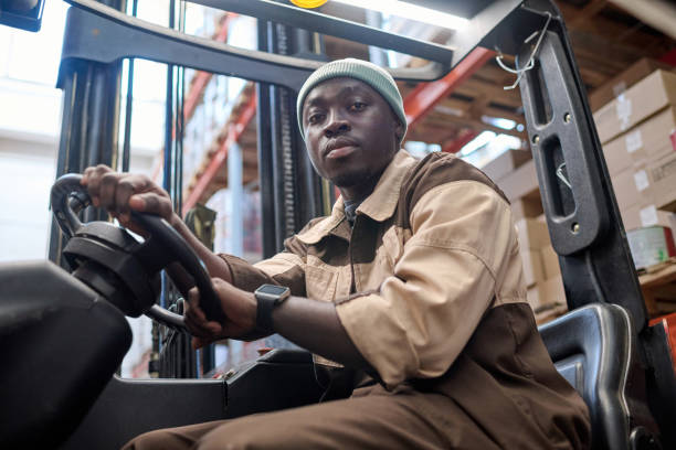 istock Worker driving forklift in industrial warehouse 1402813676