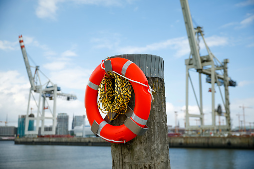 Life belt at a harbor pier in Hamburg