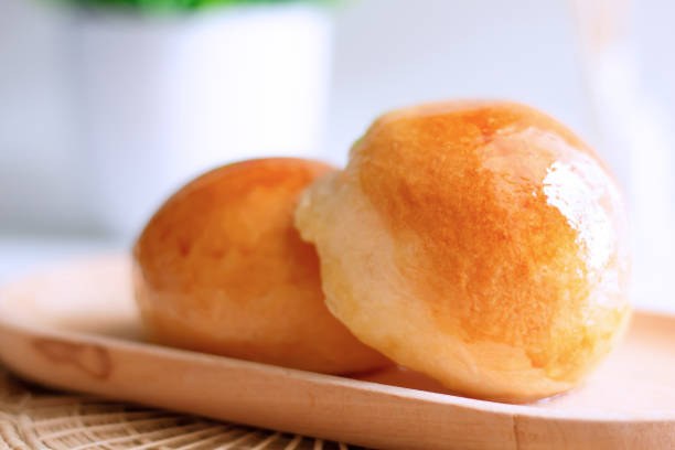 istock Close up two butter bread bun  on wooden plate 1402815718
