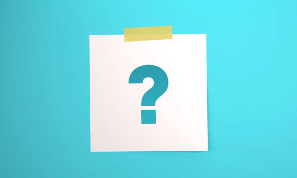 istock Note paper with Question Mark attached to blue background with tape. 1402817813