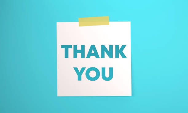 istock Note paper with Thank You message attached to blue background with tape. 1402818586