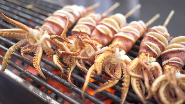 istock Grilling a squid BBQ in Bangkok - Thailand. 1402818594