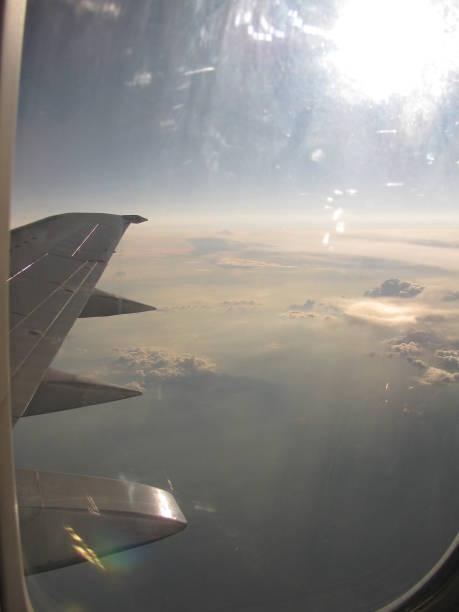 istock View from airplane window above the clouds 1402820473