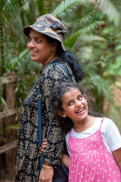 istock mother and daughter walking around park 1402821439