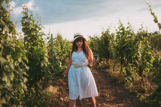istock Woman in vineyard 1402823970