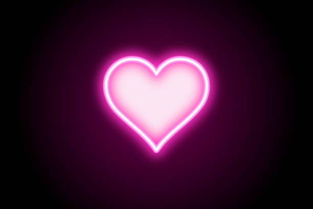 istock Neon pink glowing glowing heart icon on black background 1402825493