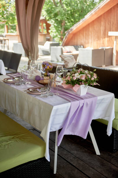 istock Table setting with sparkling wineglasses, plate and cutlery on table, copy space. Place set at wedding reception. Table served for wedding banquet in restaurant 1402826771