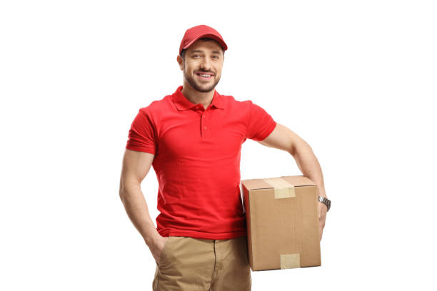 istock Delivery courier holding a cardboard box 1402826957