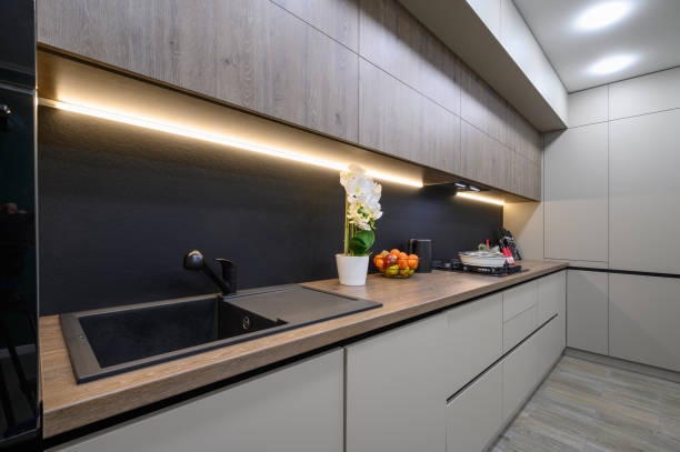 istock Trendy grey modern kitchen interior with minimalistic furniture 1402827112
