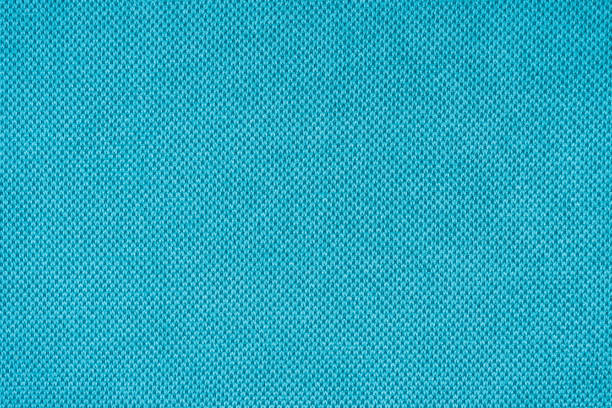 istock Turquoise velours upholstery fabric texture background. 1402830707