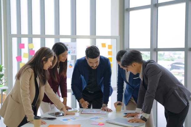 istock White collar workers are meeting on the table. 1402832350