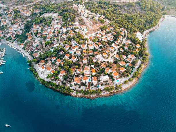 Beautiful villages Splitska on island Brac, Croatia. Aerial view. Crystal blue water. Adriatic sea Drone picture, you can see crystal blue water with villages neas seaside. Beautiful architecture, interisting design of town. brac island stock pictures, royalty-free photos & images