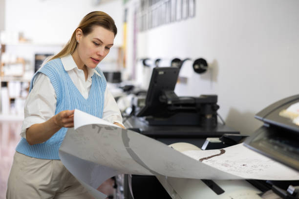 istock Woman working in publishing facility 1402835641