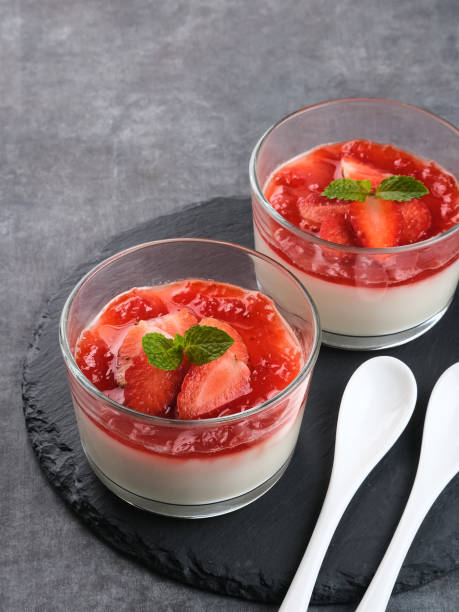 Sweet vanilla silky pudding dessert with strawberry sauce