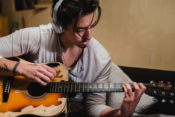 istock young man relaxing at home 1402839867