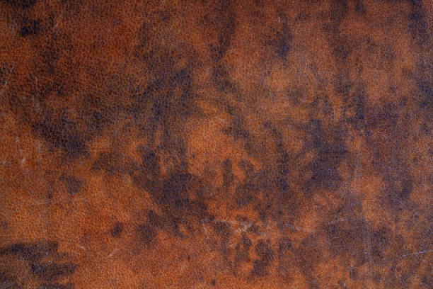 Dark brown mottled pattern leather texture background, high resolution stock photo