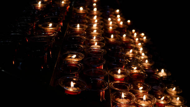 istock Candles burning in a catholic church 1402841070