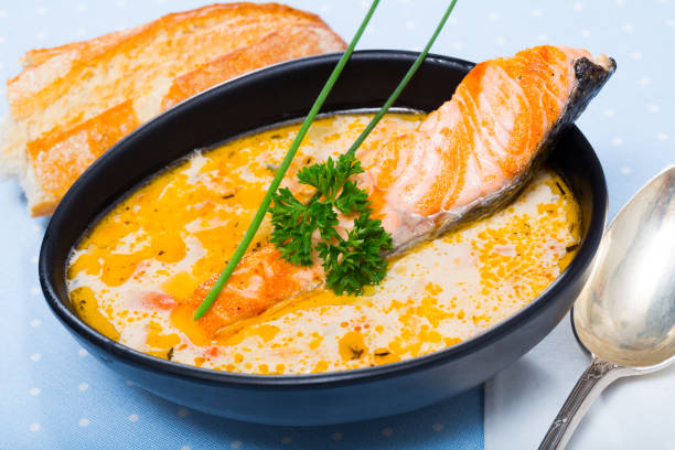 istock Salmon cream soup with bread 1402841235