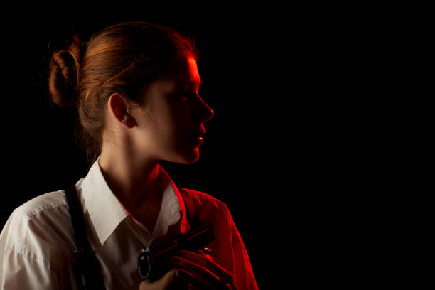 istock woman with gun 1402841711