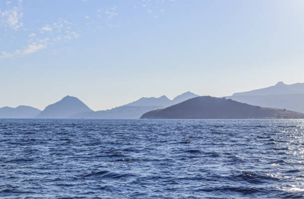 istock Blue sea with islands and mountains. Summer holidays concept 1402841942