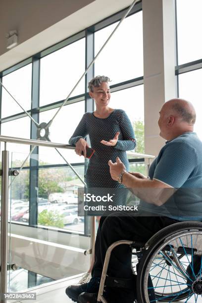 Working In Luxury Showroom Stock Photo - Download Image Now - Assertiveness, Leadership, Accessibility for Persons with Disabilities