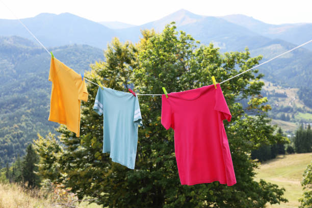 istock Washing line with clean laundry and clothespins in mountains 1402843960