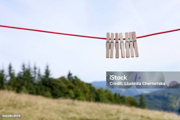Wooden Clothespins Hanging On Washing Line In Mountains Stock Photo - Download Image Now