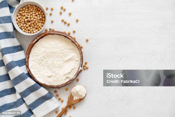 Chickpea And Flour In Ceramic Bowl On White Background Stock Photo - Download Image Now