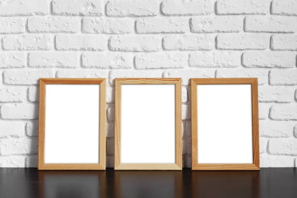 istock Blank picture frame against brick wall with copy space 1402850581