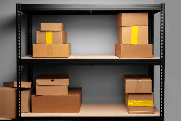istock Rows of shelves with cardboard boxes in modern warehouse 1402850742