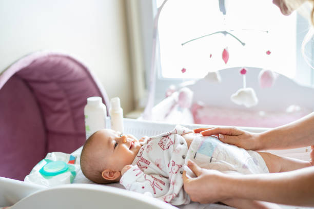 istock Baby in bedroom getting diaper changed 1402851819