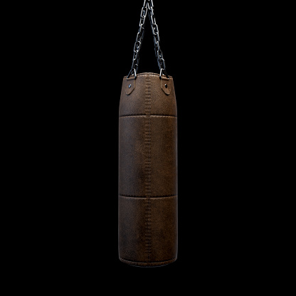 A old worn vintage leather punching bag hanging by heavy chains on an isolated black studio background - 3D render