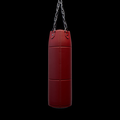 A red modern leather punching bag hanging by heavy chains on an isolated black studio background - 3D render