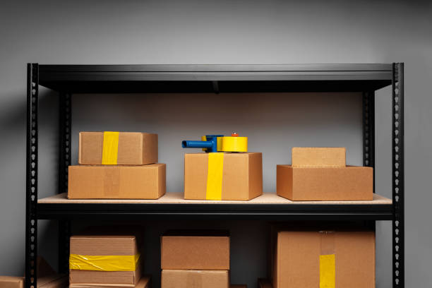 istock Rack shelves with paper boxes in warehouse. 1402853038