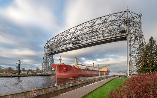 A ship passes through the canal under the aerial Lift Bridge in Duluth