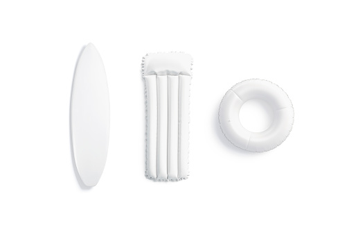 Tabla de surf blanca en blanco, colchón de baño y maqueta de anillo, aislado photo