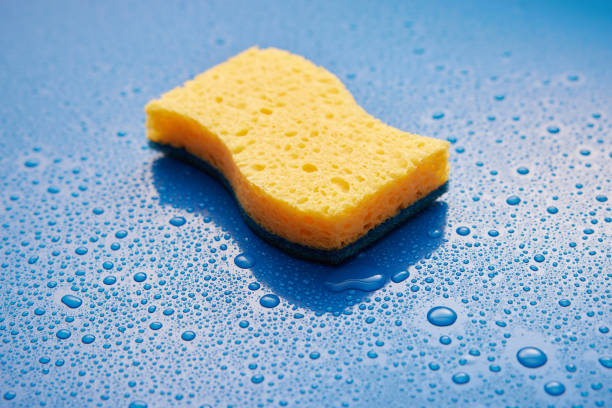istock Wash sponge on table with water drops 1402858846