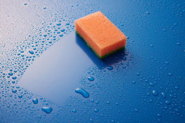istock Wash sponge on table with water drops 1402858923